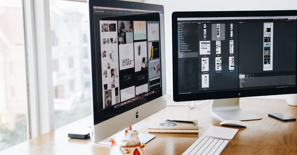 A sleek modern office setup featuring dual monitors, Apple devices, and creative decor in an indoor workspace.